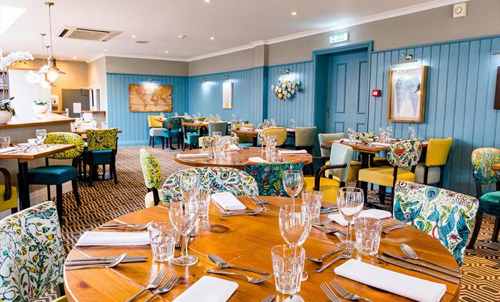 Dining area inside Oscar’s Brasserie at Rossett Hall Hotel.